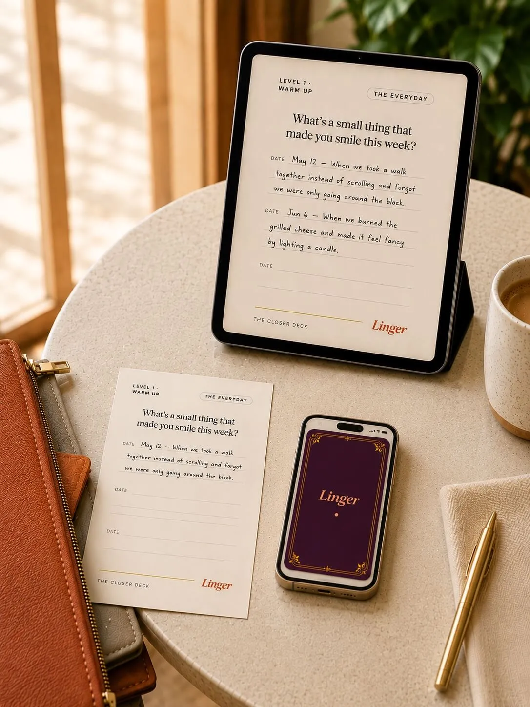 The Linger Closer Deck shown on a tablet, phone, and printed card on a table.